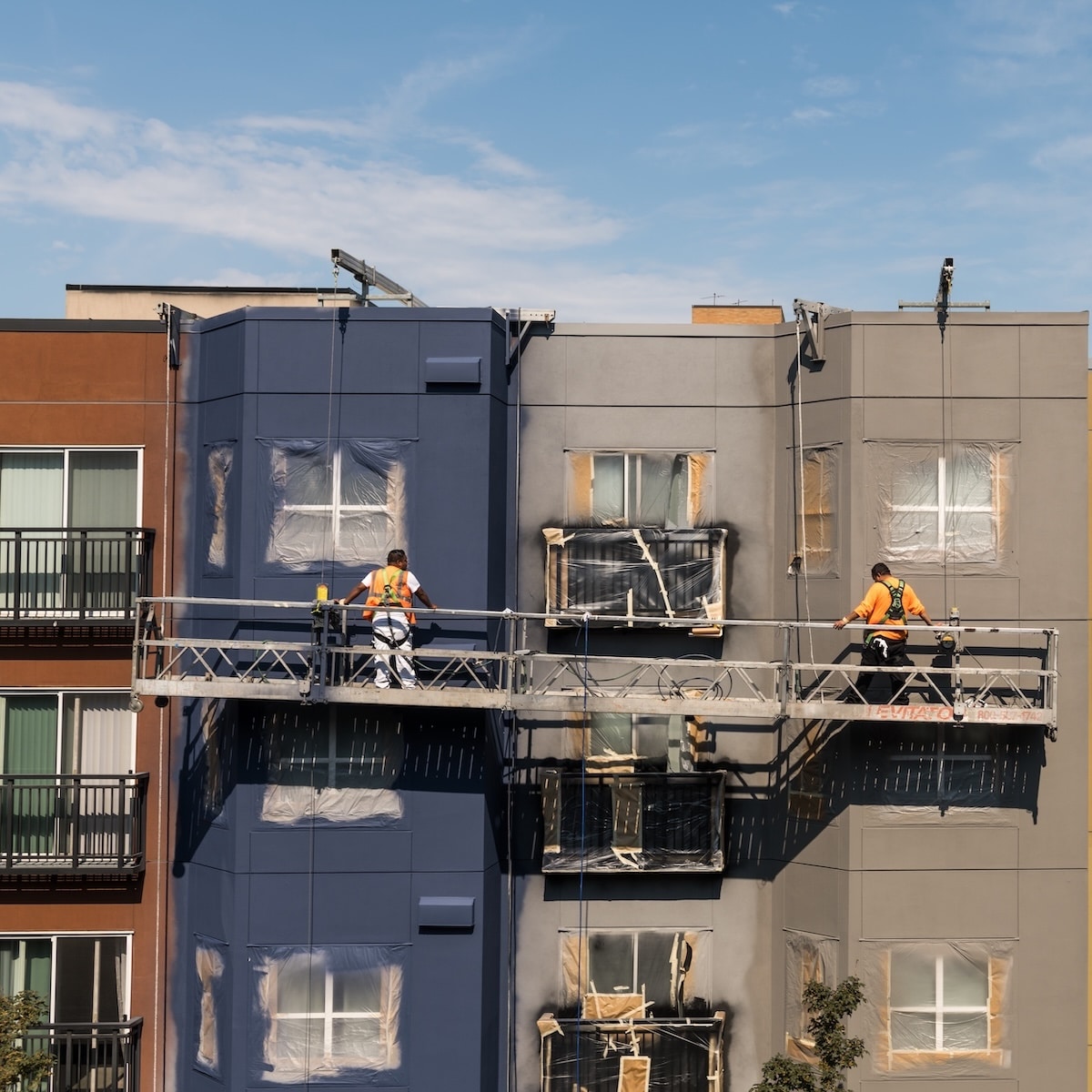 Commercial Painters Conduct Exterior Fall Painting From A Swing Stage - Downtown Seattle