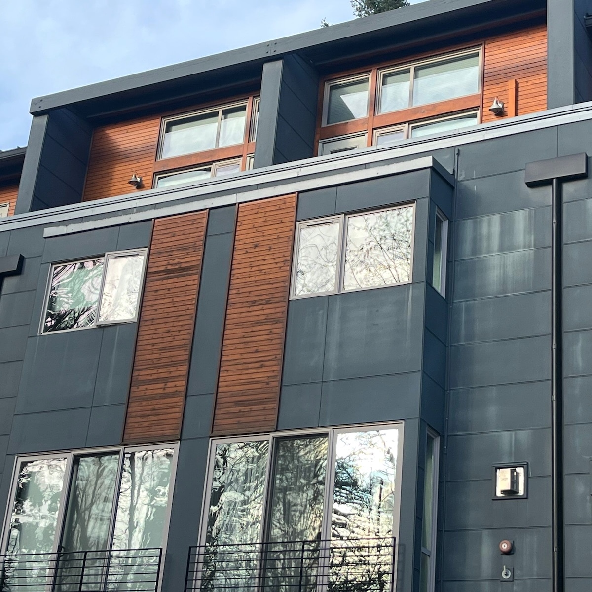 Fiber Cement Siding (blue) Experiencing Chalking. Pressure-Wash And Repaint To Refresh.
